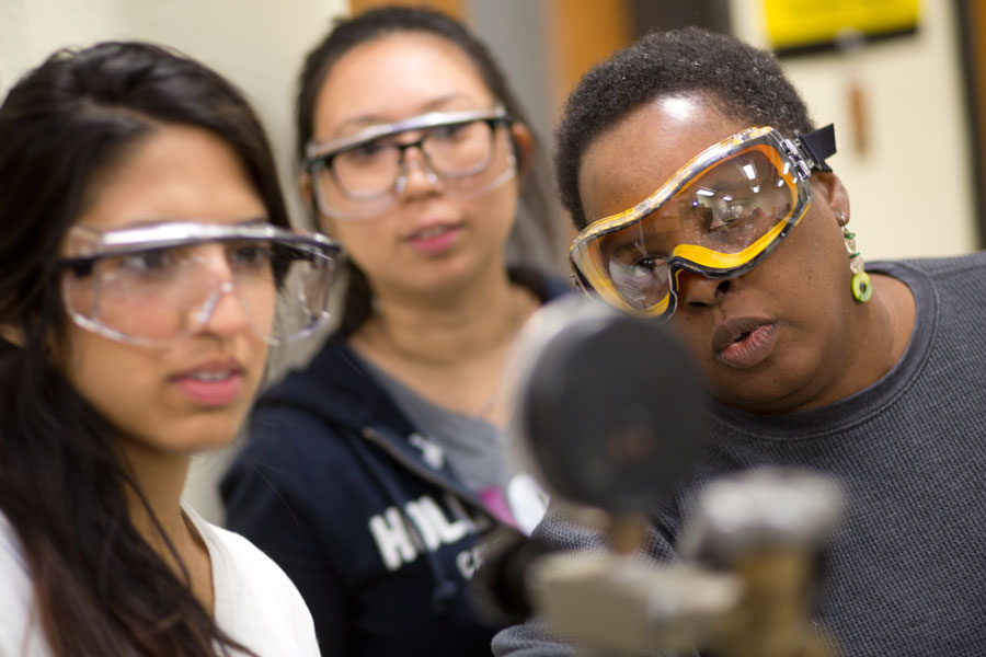Mary Crawford, Chemistry professor, with her students. 