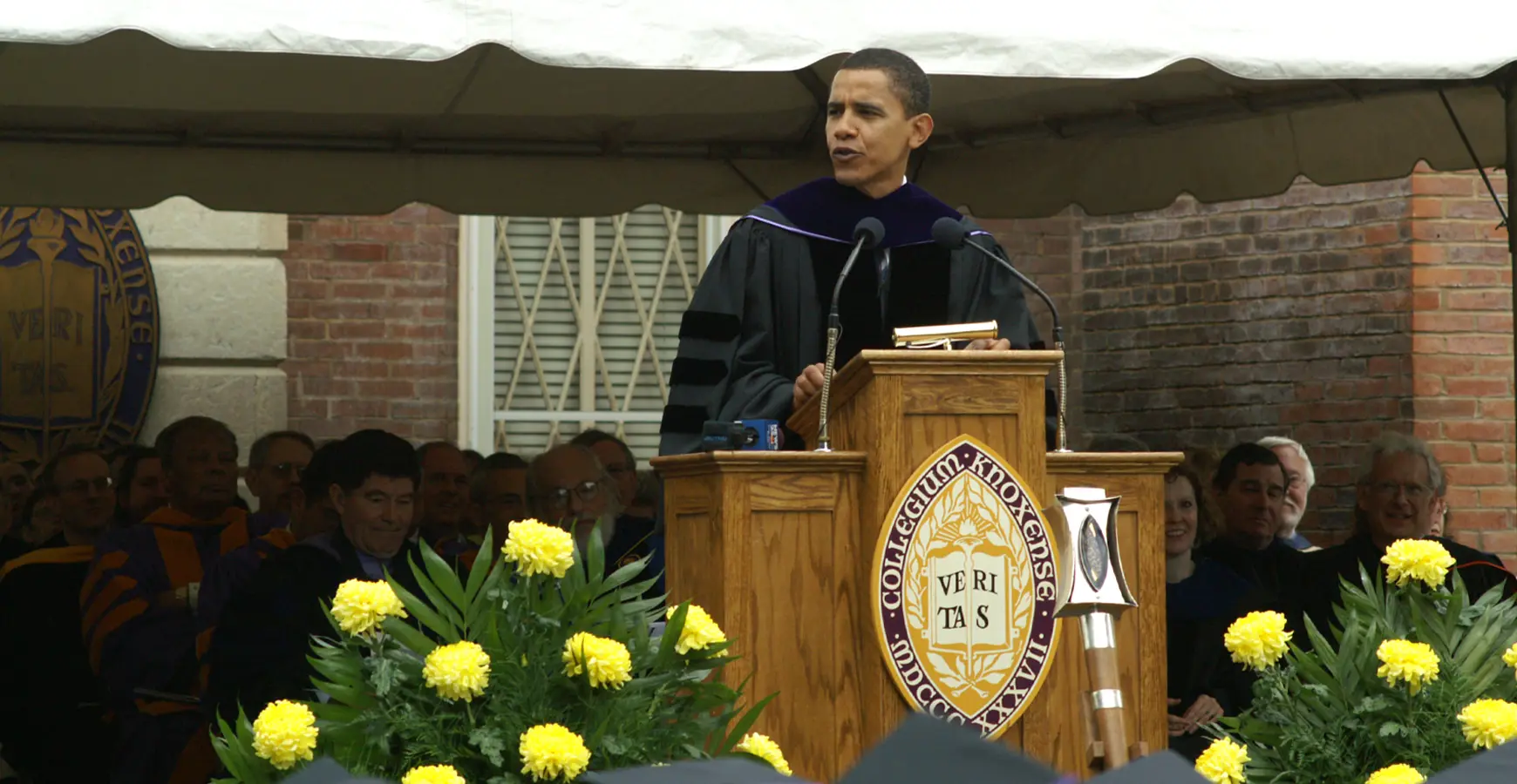 President Obama stands at a podium during Knox's 2005 Commencement and speaks.