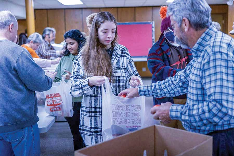 knox students volunteering for blessings in a backpack. 
