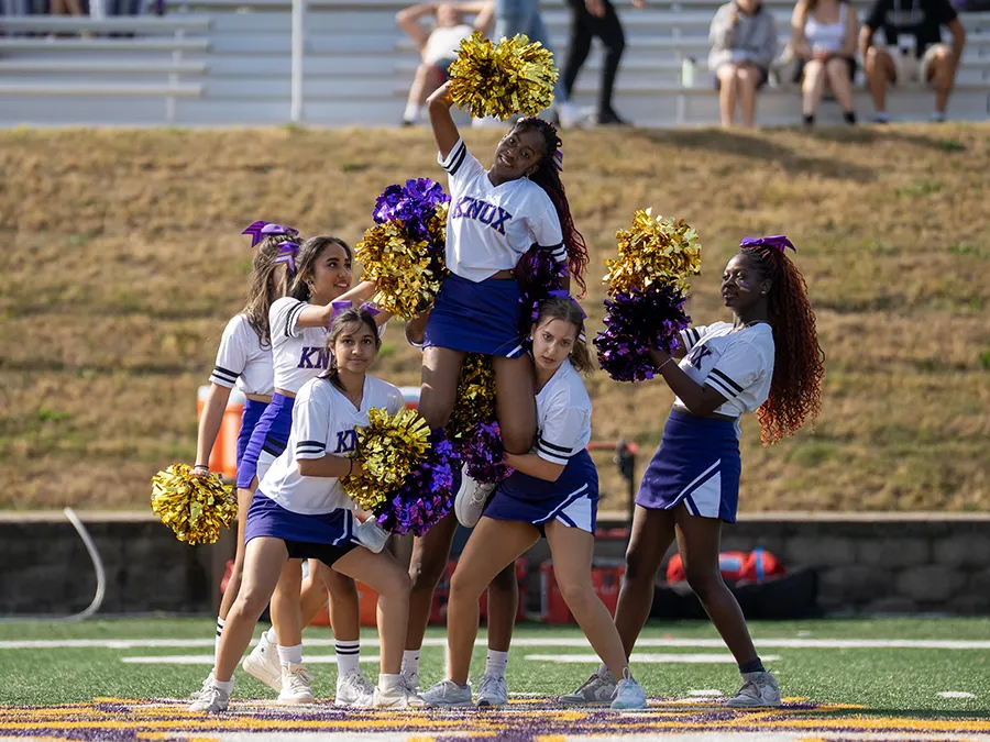 Members of the Knox cheer team perform at halftime of the homecoming game.