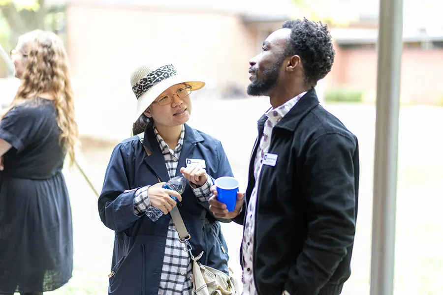 Members of the Knox faculty talk together during the Academic Showcase.