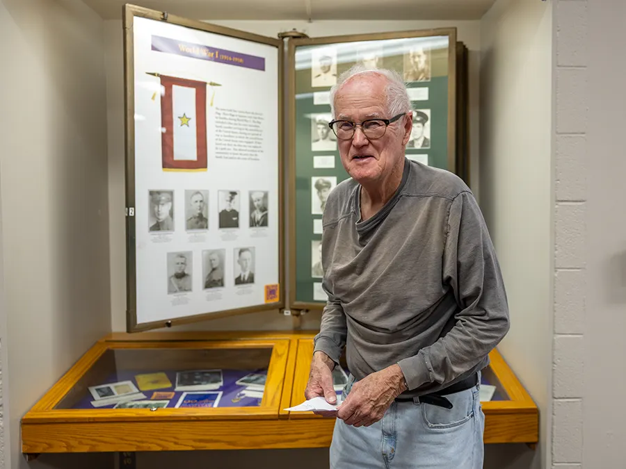 Jamie Bjorkman '57 helps add to the 99 Lives Gold Star Memorial