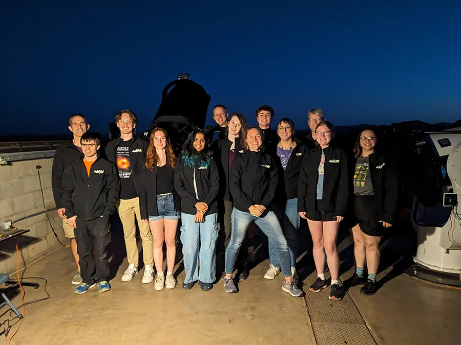 Faculty, staff, and students from Knox, Macalester, Augustana, and Iowa at the telescope.