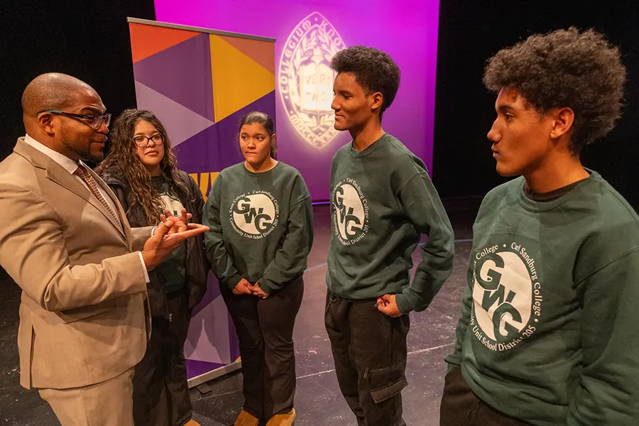 Melvin Rogers greets members of the Gale Scholars program.