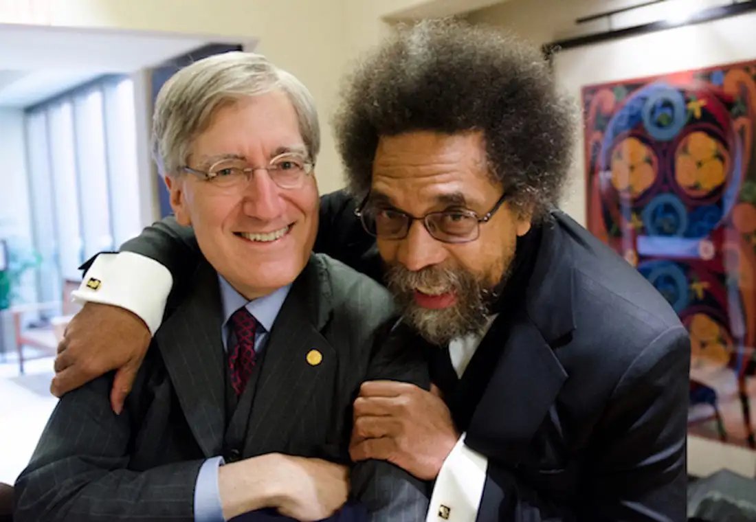 Robert P. George on the left and Cornel West on the right. Cornel has his arm around Robert.
