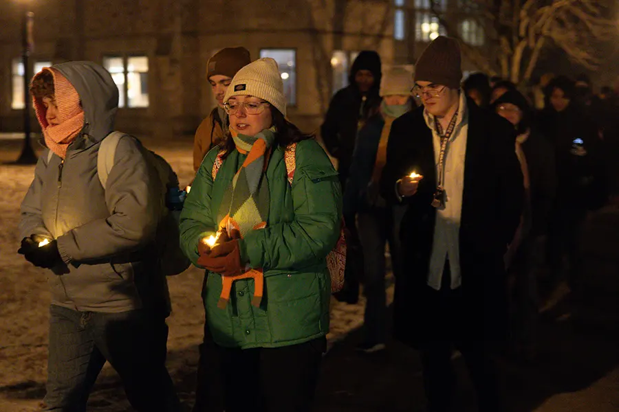 Knox community members participate in a candlelight vigil.