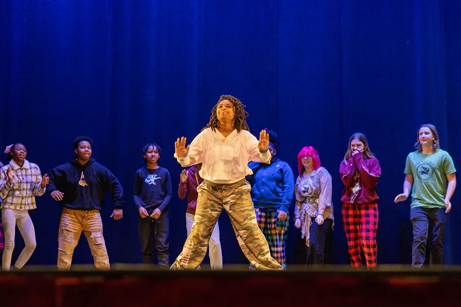 Area students participate during Chicago Dance Crash's history of hip hop performance.