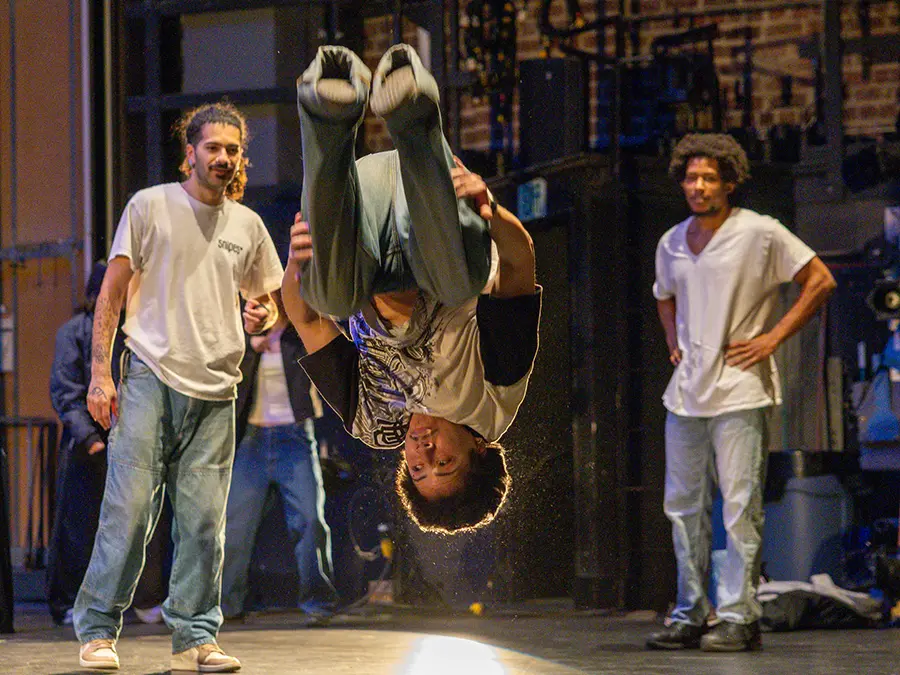 A member of Chicago Dance Crash flips during their YES performance for area students.