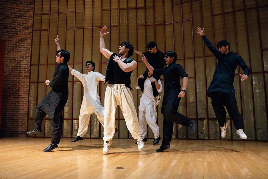 A group of Knox students dance on stage.