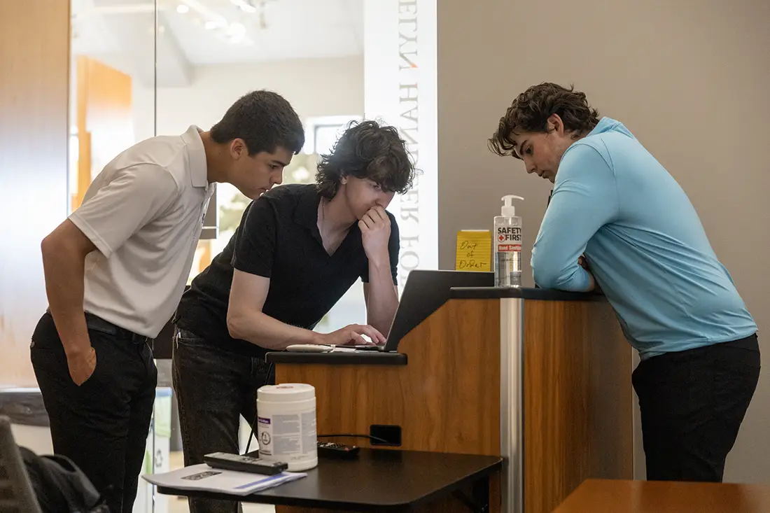 Members of the SEZN Team go over their presentation.