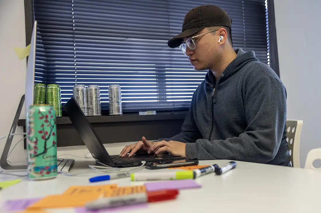 A student works on his StartUp Term project. 