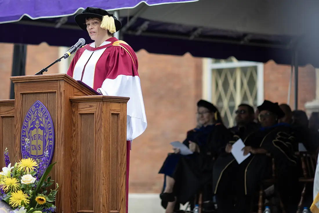 Provost and Dean of the Faculty Melissa Glenn stands at a podium and speaks.