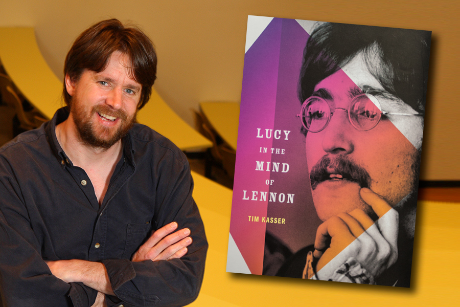 Psychology professor Tim Kasser with his book on John Lennon.