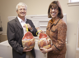 Mauri Ditzler and Teresa Amott donate turkeys to a food pantry