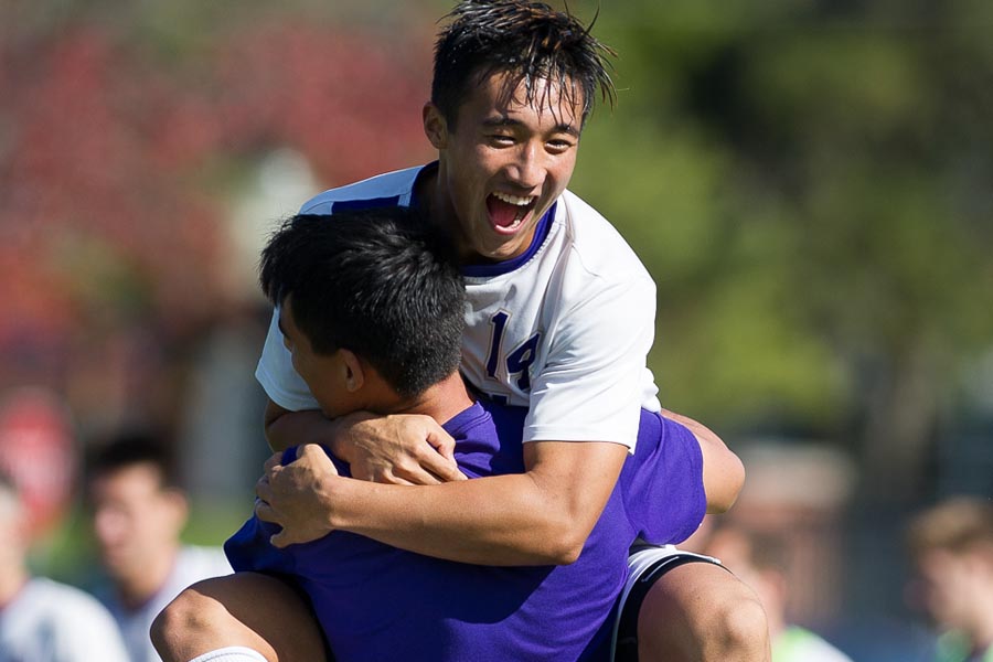 Knox College men's soccer player Shu Kitamura celebrates scoring the winning goal, giving Knox the 2014 regular season conference championship on Oct. 25.
