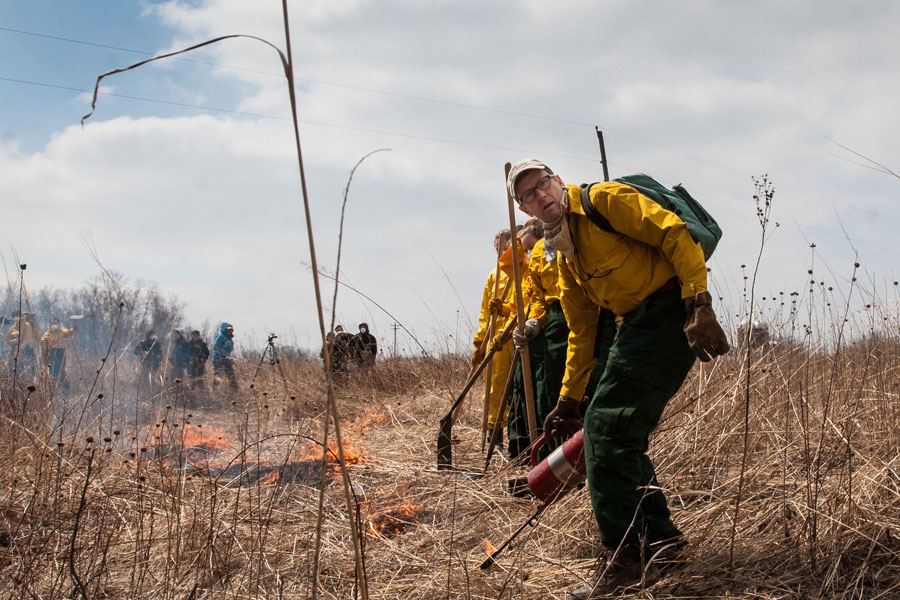 Professor Stuart Allison leads Knox students in the 2014 Prairie Burn at Green Oaks.