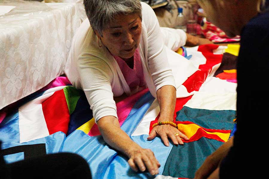 Aiyoung Choi, a Knox alumna and an advocate for social justice, works on a jogakbo, a Korean quilt.