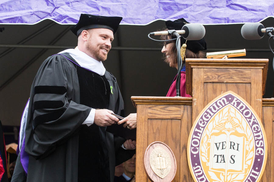 Matt Berg receives honorary degree from Knox College President Teresa Amott.