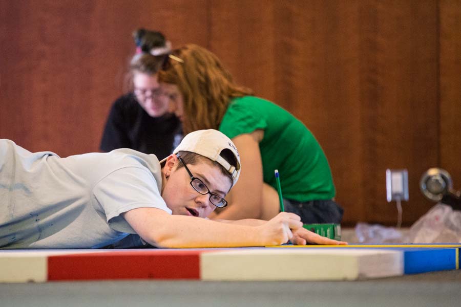 Knox College student working on an exhibit on the history of Captain America.