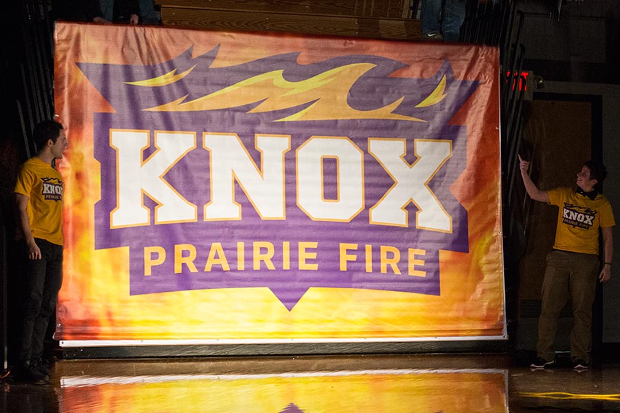 Knox College students celebrate the release of a new Prairie Fire athletic logo.