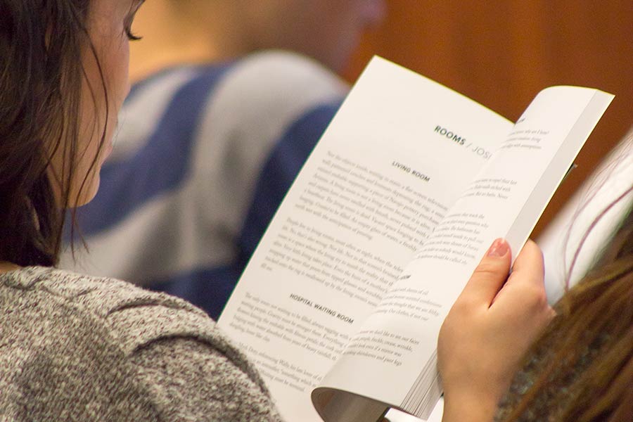 A Knox student looks over the latest issue of Catch, Knox's literary journal.