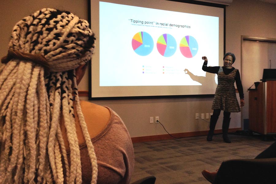 Lecia Brooks, outreach director for the Southern Poverty Law Center, encourages Knox College audience members to do what they can to promote tolerance.