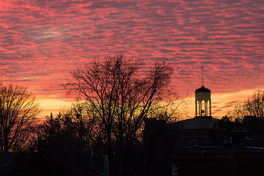 A dramatic sunset over Knox College's Old Main.