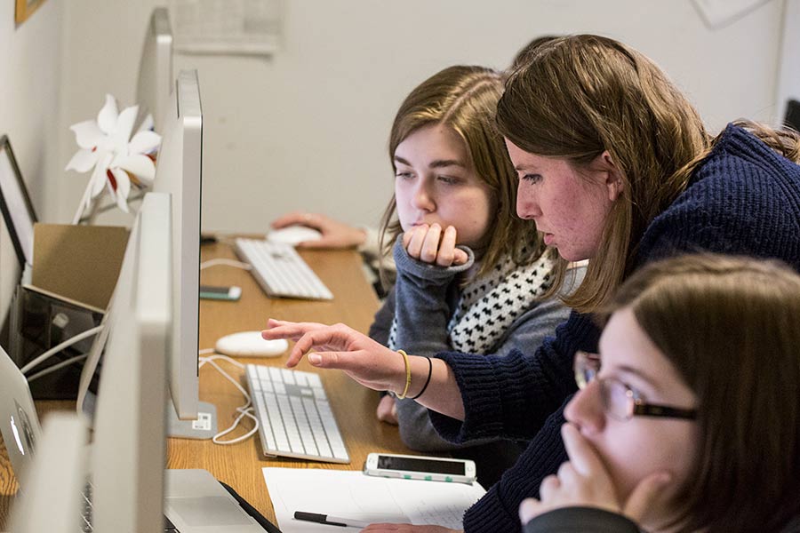 TKS students work on newspaper in publication office.