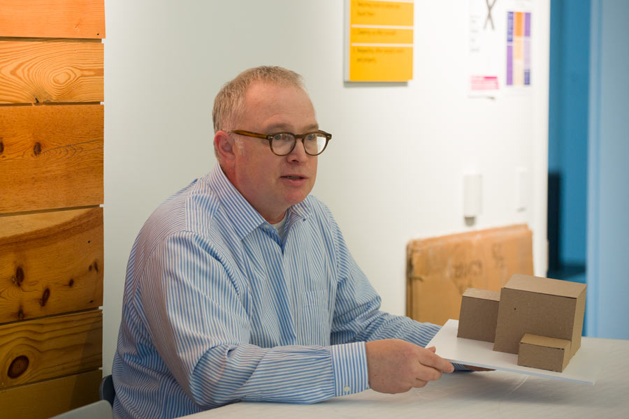Jim Harriman '82 offers advice to students as they work on their model construction