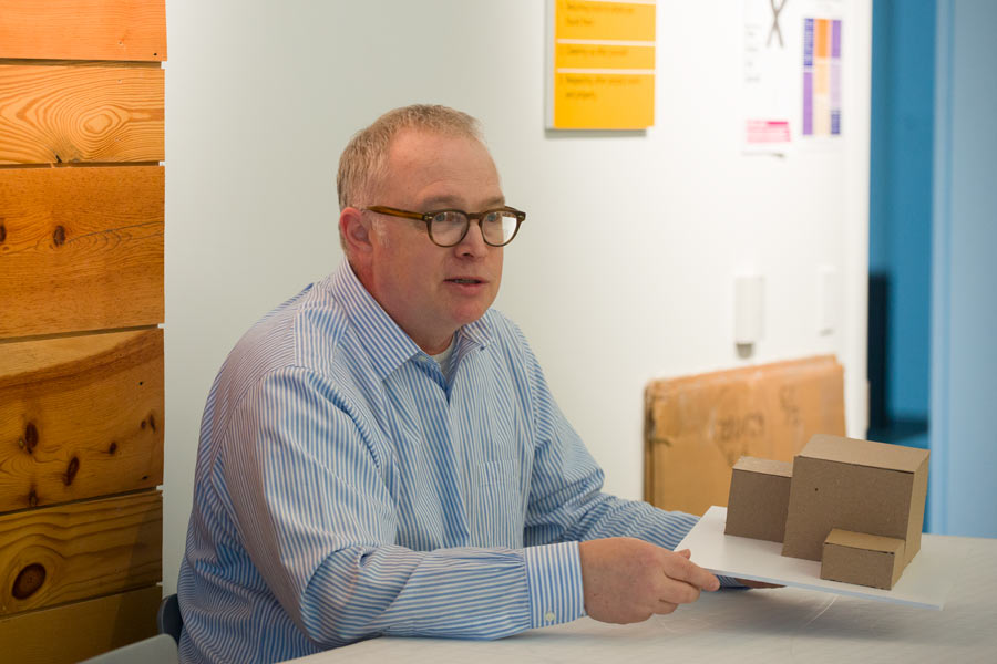 Jim Harriman '82 offers advice to students as they work on their model construction