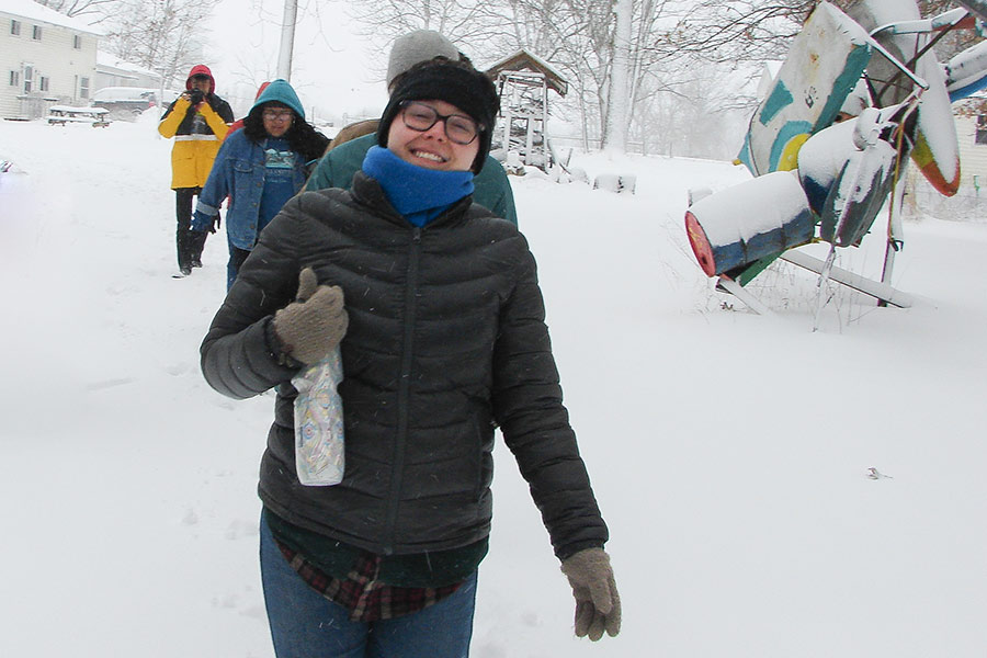 Knox College students walking in the snow at Green Oaks Biological Field Station.