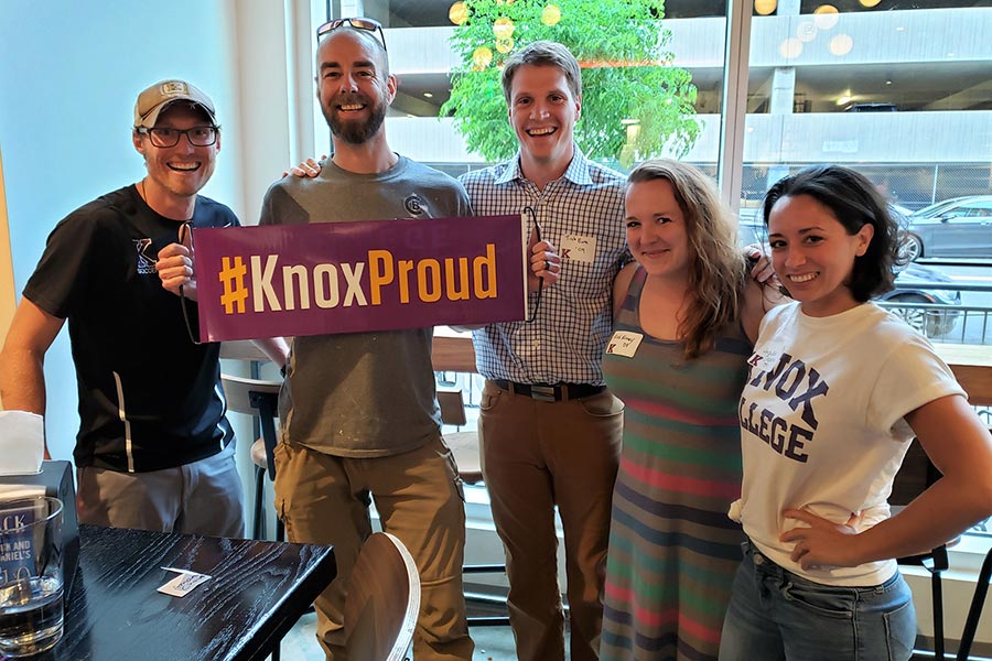 Alumni guests at one of 14 #KnoxProud Day events on June 13 display a #KnoxProud banner.