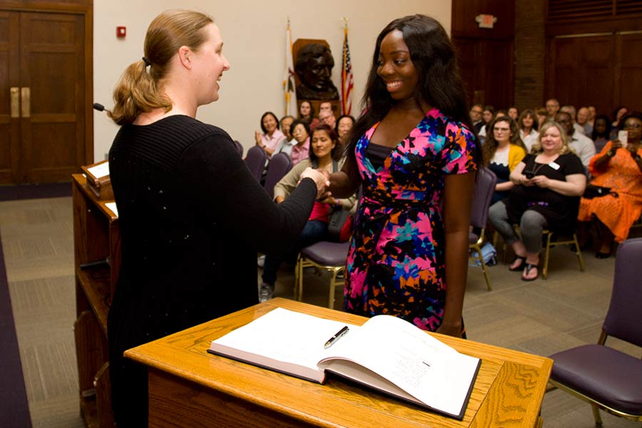 A student is inducted into the Knox chapter of Phi Beta Kappa