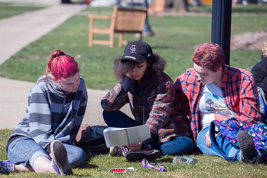 Students from an Ancient Greek language course gather outside for a reading of a new translation of Homer's Odyssey.