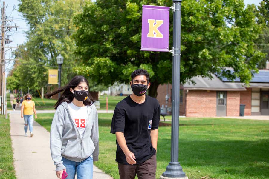 Knox students walk on campus while wearing facial masks during the first day of class