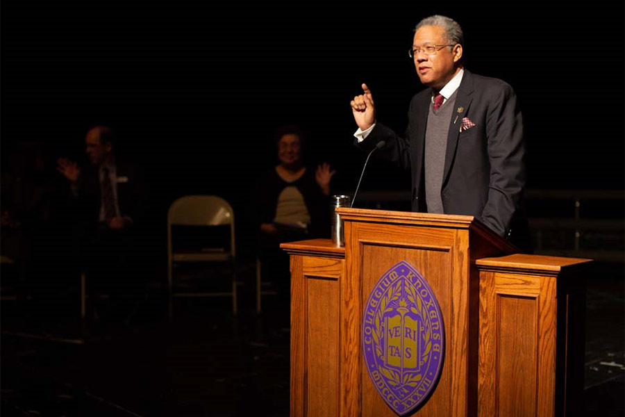 Burkhardt Distinguished Associate Professor of History Konrad Hamilton speaks of the importance of voting at winter convocation at Knox College.