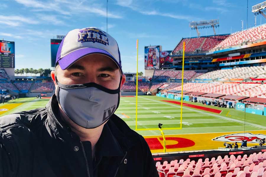 Andrew Isaacson '99 stands inside Raymond James Stadium at Super Bowl LV in Tampa