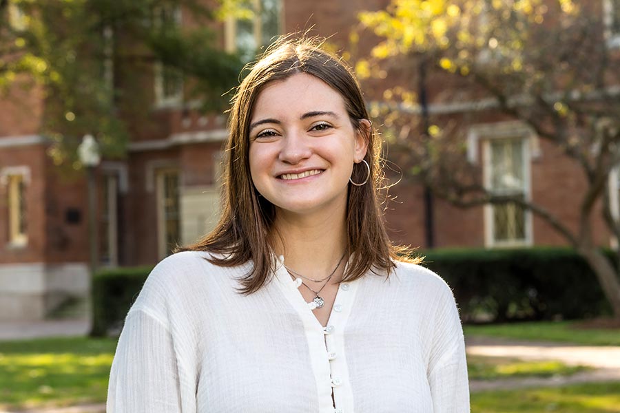 Becca Gadiel stands in front of Old Main