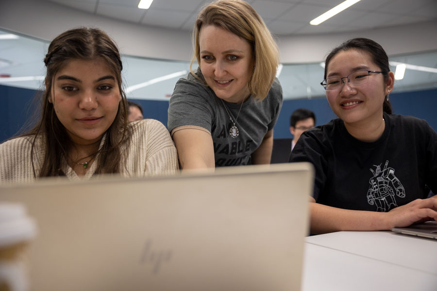 Students working on a computer in the gamer class.