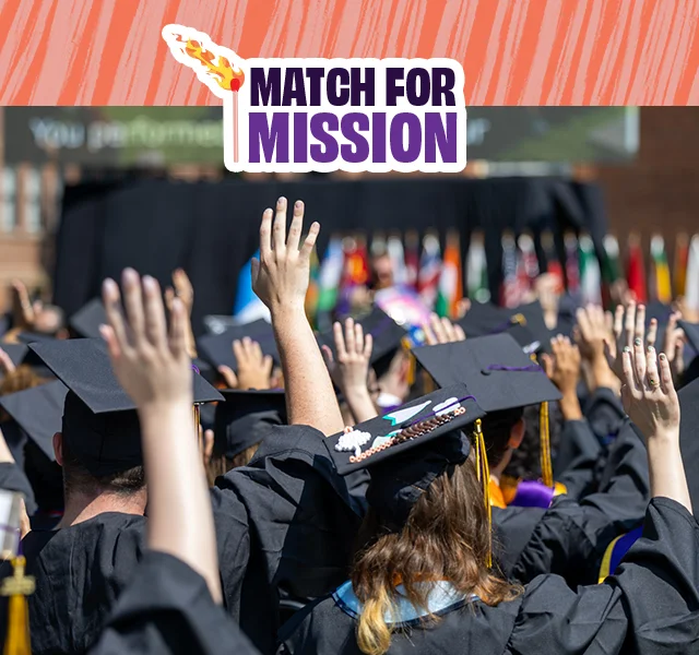Graduates celebrating and clapping at the 2025 Knox College Commencement. The words Match for Mission are at the top of the image.