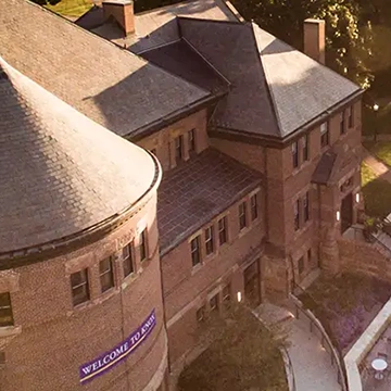 Alumni Hall photographed from above, as the sun rises.