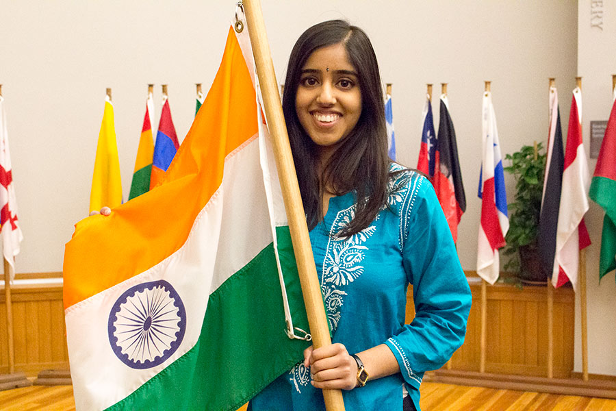 Sruthi Doniparthi '16 poses with her flag at International Fair photo session. 