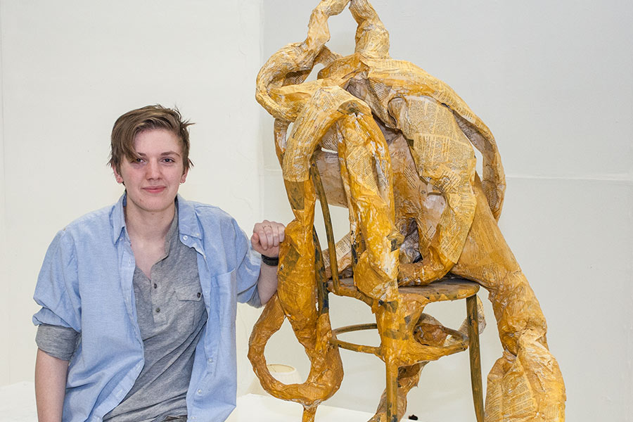 Emma Lister '17 with one of her sculptures. 