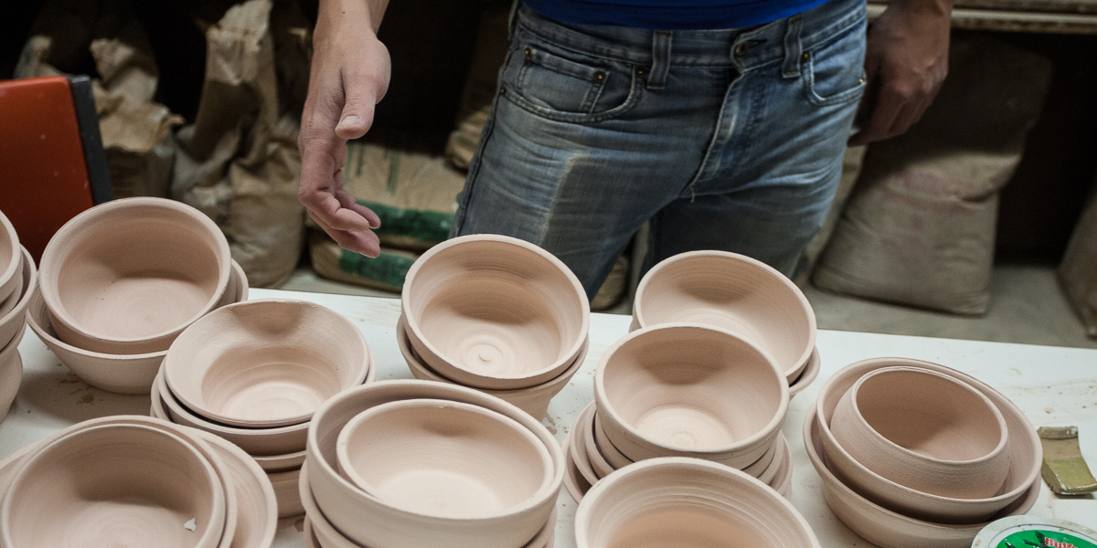 Stacks of ceramic bowls created by students in the ceramics studio. 