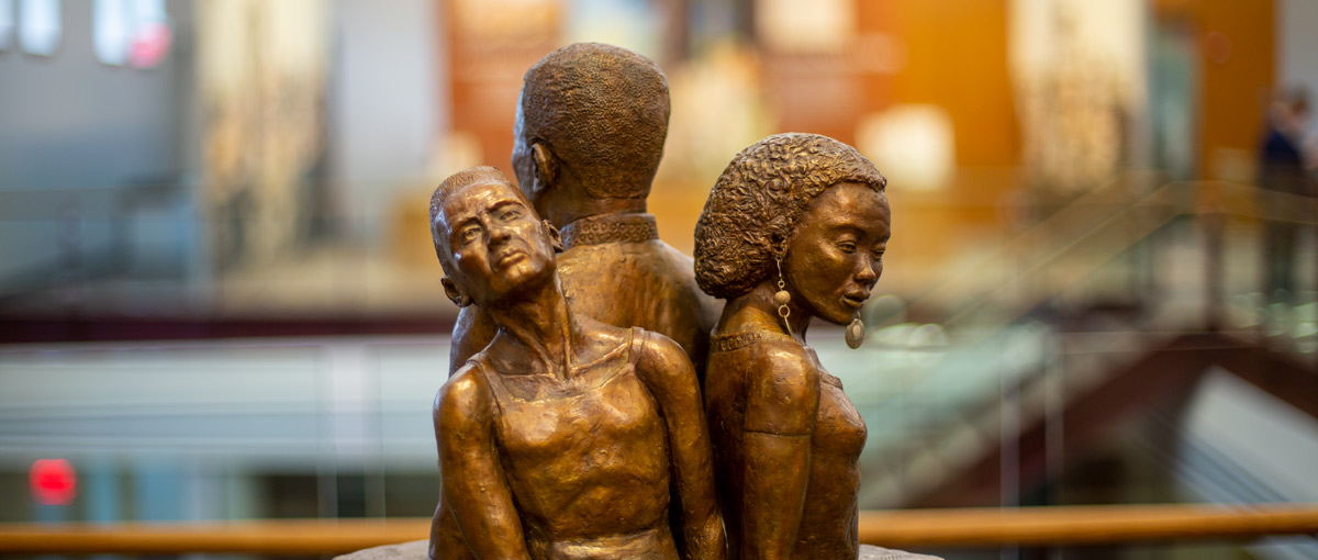 "Got Your Back", sculpted by Fay B. Stevenson-Smith '64, is displayed in the Whitcomb Heritage Center, located inside of Alumni Hall.