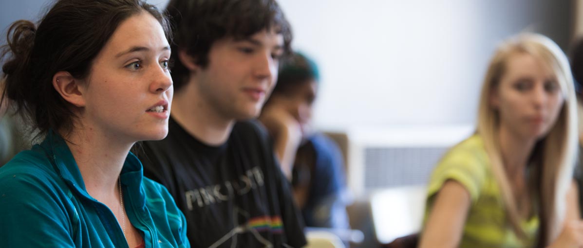 A student engages in dialog. 