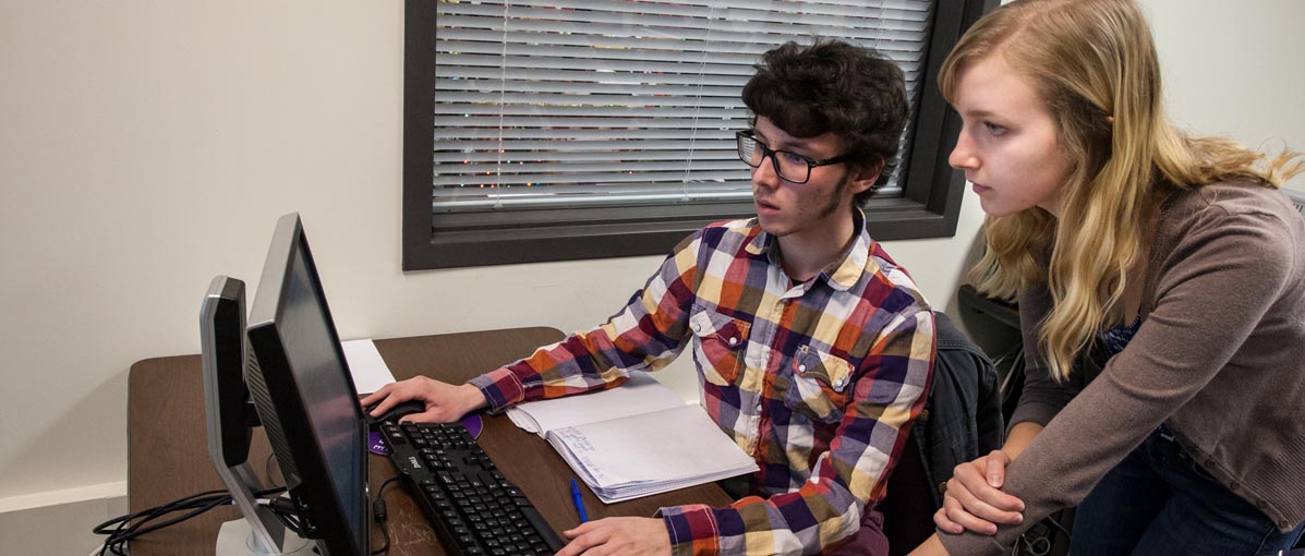 Students analyze data during a psychology lab in the Stellyes Computer lab in the Umbeck Science-Mathematics Center. 