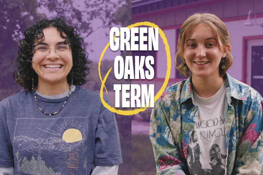 Two students smile at the camera. The Knight Living & Learning Center is visible in the background. Text on screen says Green Oaks Term.